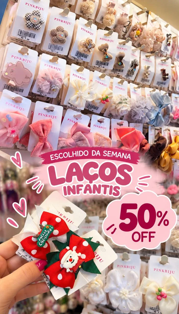 Escolhido da Semana: laços infantis com 50% de desconto — laços de Natal vermelhos com Papai Noel e laços de tule, flor e veludo na vitrine da PinkBiju